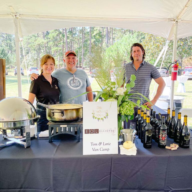 employees standing at vendor table from the vineyard house and elliots